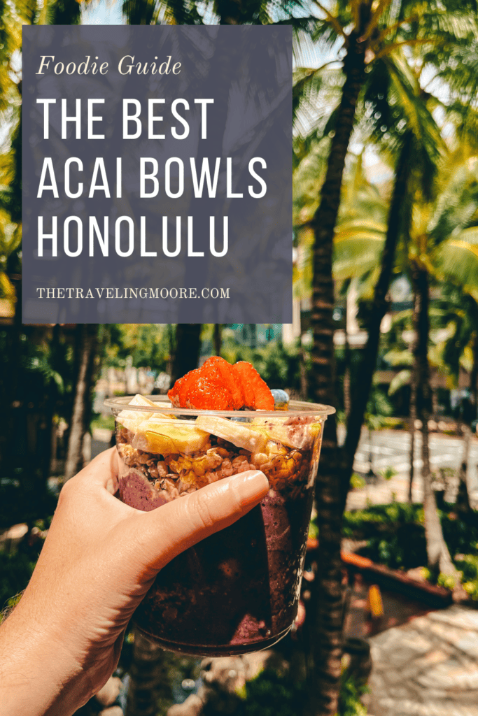 Pinterest pin that says the best acai bowls honolulu with a picture of a hand holding an acai bowl