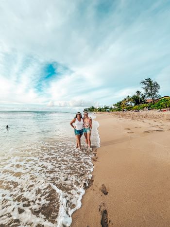 Two girls at beach at north shore of Oahu