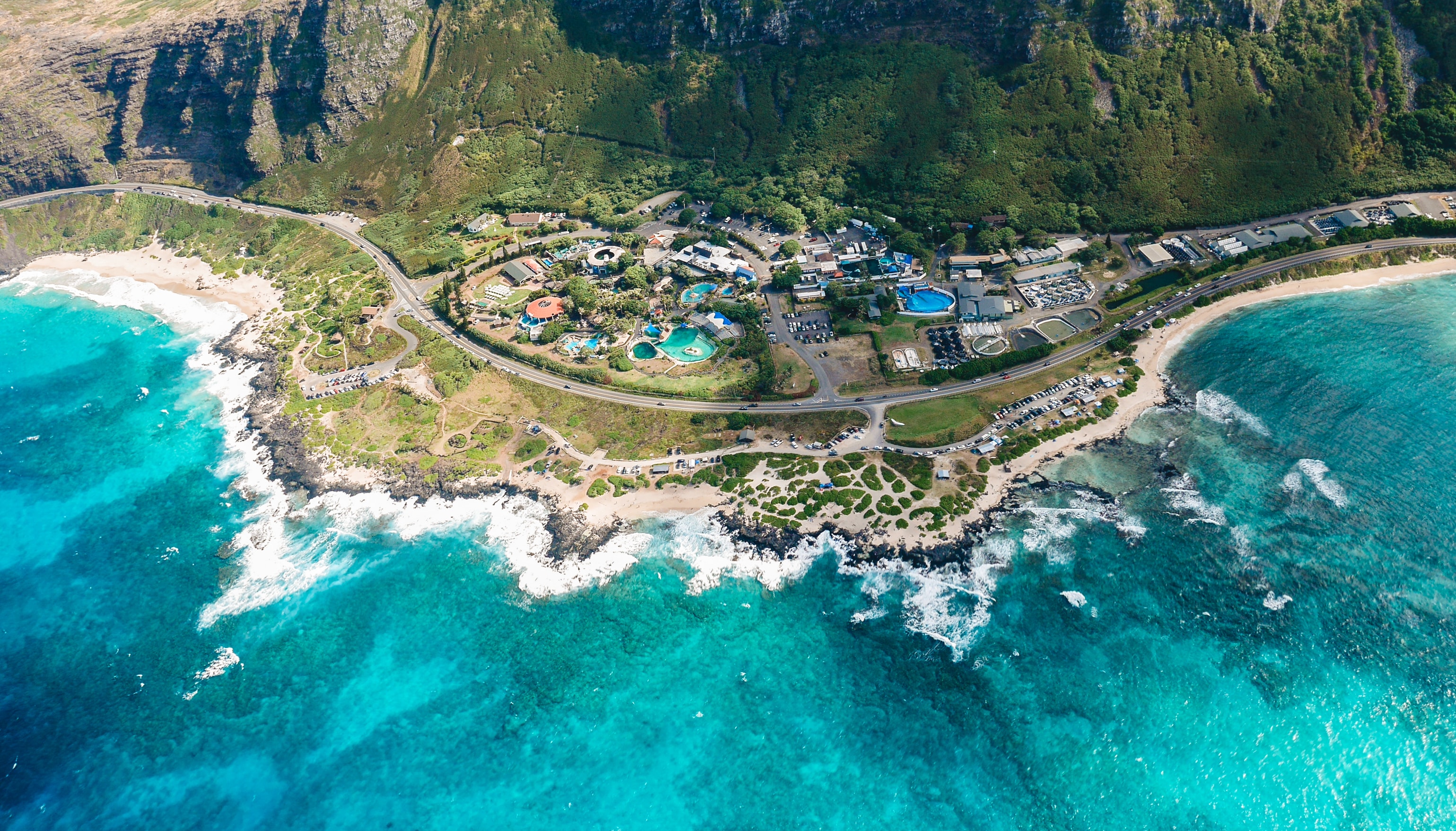 Drone shot of the turtle bay resort that shows the resort, ocean, and mountains