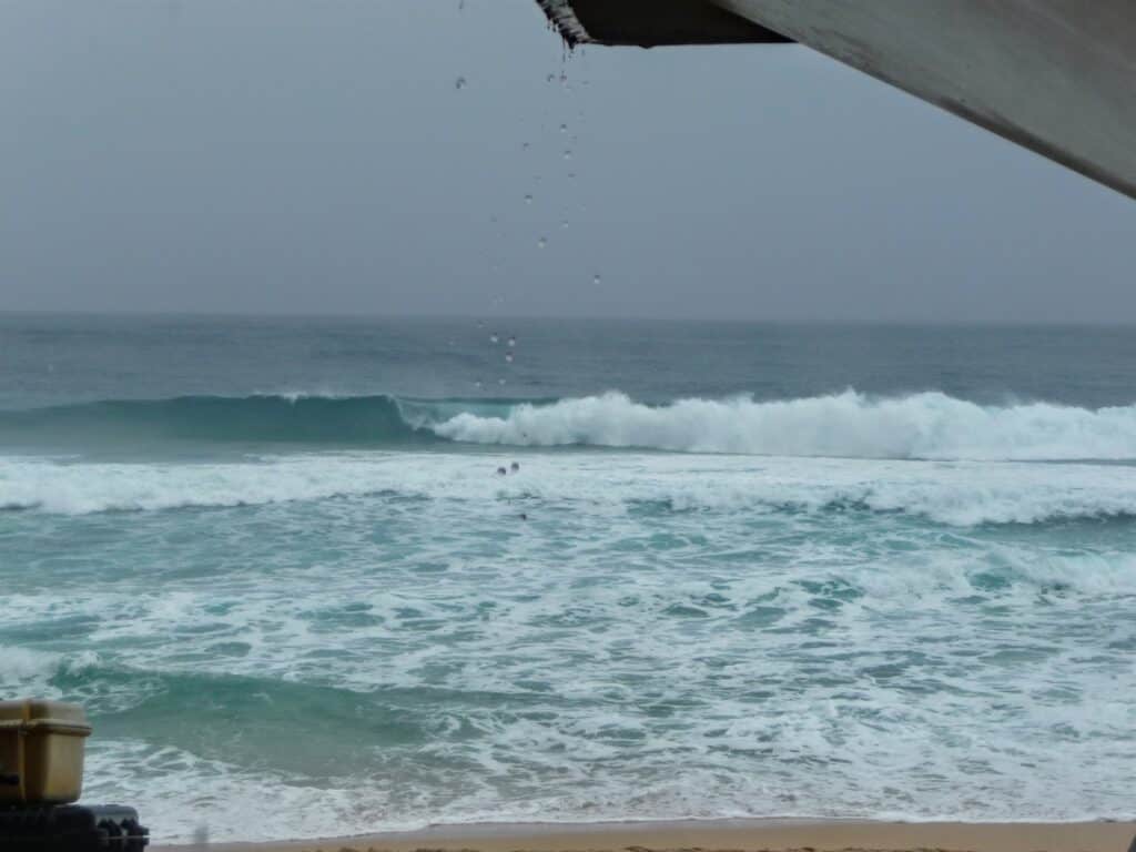 Waves crashing on a beach in hawaii