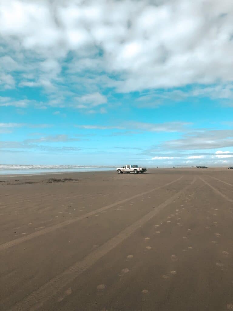 cars driving on the beach in ocean shores washington