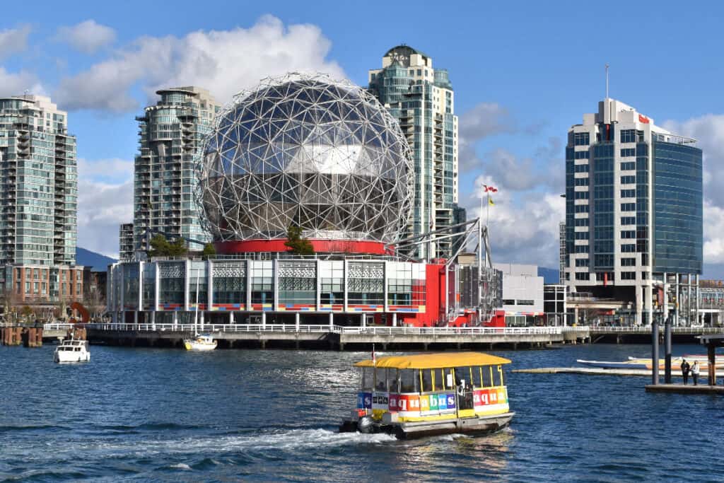 Vancouver BC waterfront with a water taxi and high rise buildings