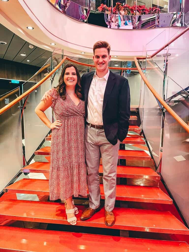 Couple standing on stairs during a cruise formal night