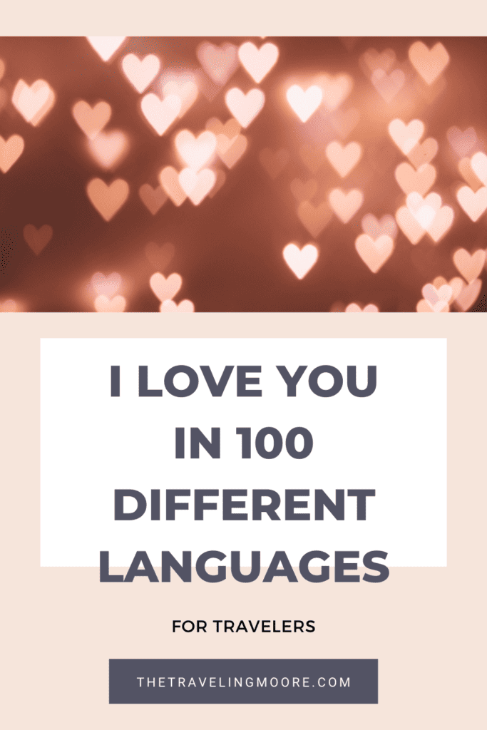  graphic image featuring the phrase 'I LOVE YOU IN 100 DIFFERENT LANGUAGES' for travelers, set against a bokeh background with heart-shaped lights. 
