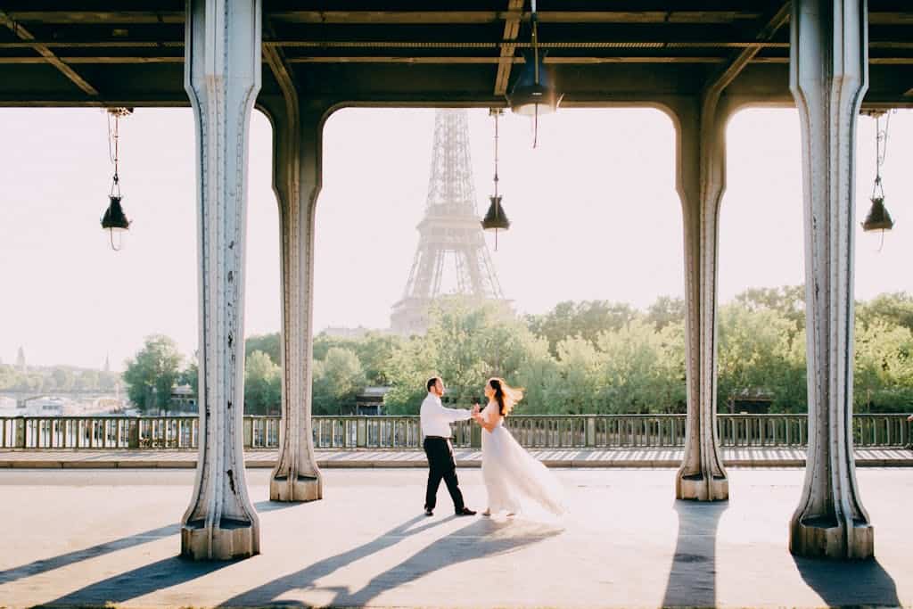 Couple Dancing on Bridge Overlooking Eiffel Tower