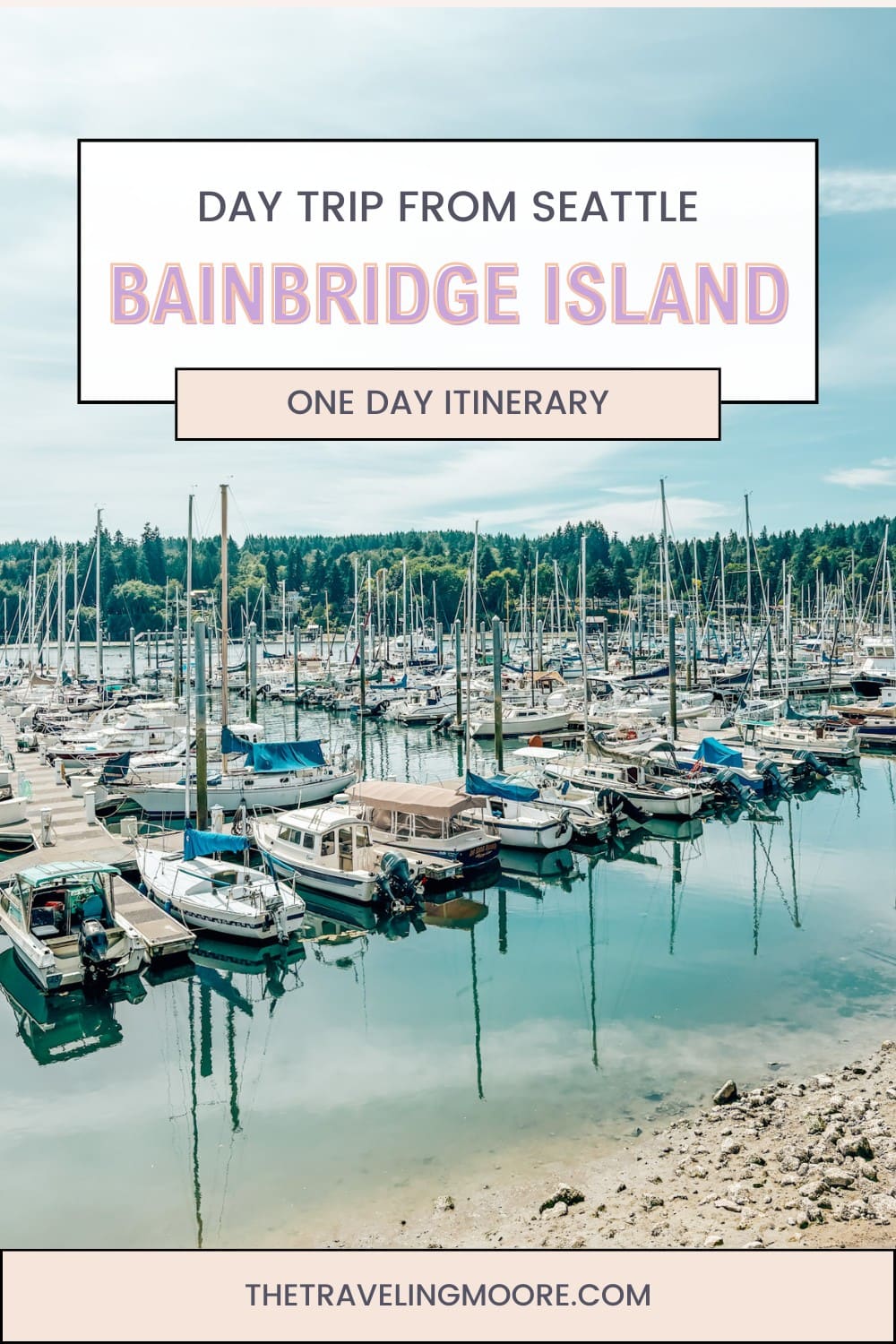 Promotional graphic for a Bainbridge Island day trip from Seattle, featuring a marina scene with rows of docked boats reflected in calm water. Overlaid text reads “Day Trip from Seattle – Bainbridge Island – One Day Itinerary” with thetravelingmoore.com listed at the bottom.